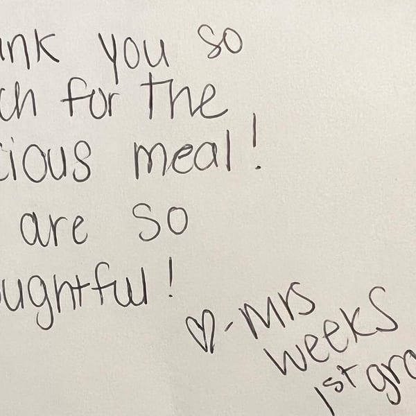 A handwritten thank you note from "Mrs. Weeks 1st grade" for a delicious meal.